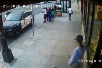 Bystanders Argue with Police Officers, Ambulance Arrives - Surveillance Video